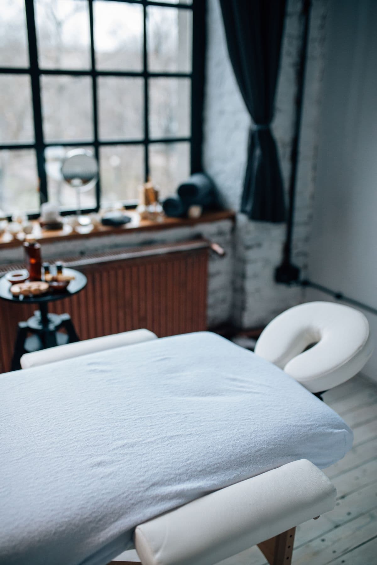 A portable massage table fully set up and ready in a client's home.