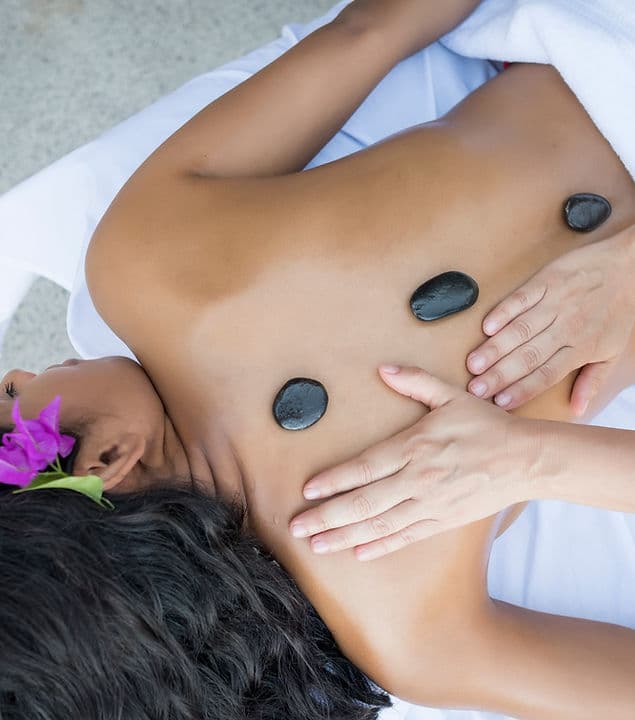 Massage table set up in a client's home living room for a mobile massage session.